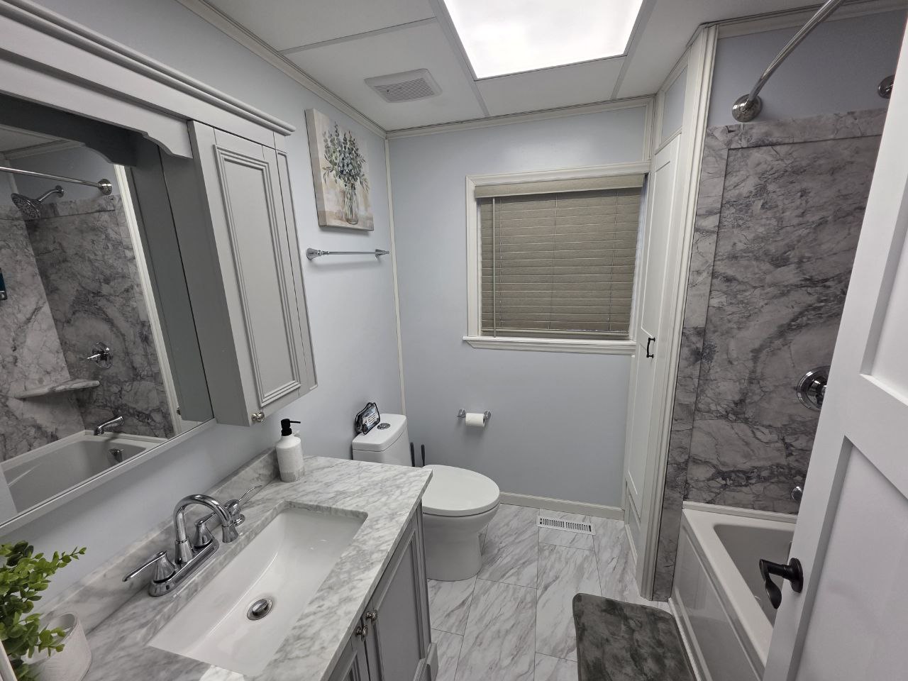 Marble bathroom with walk-in shower in Morgantown short term rental