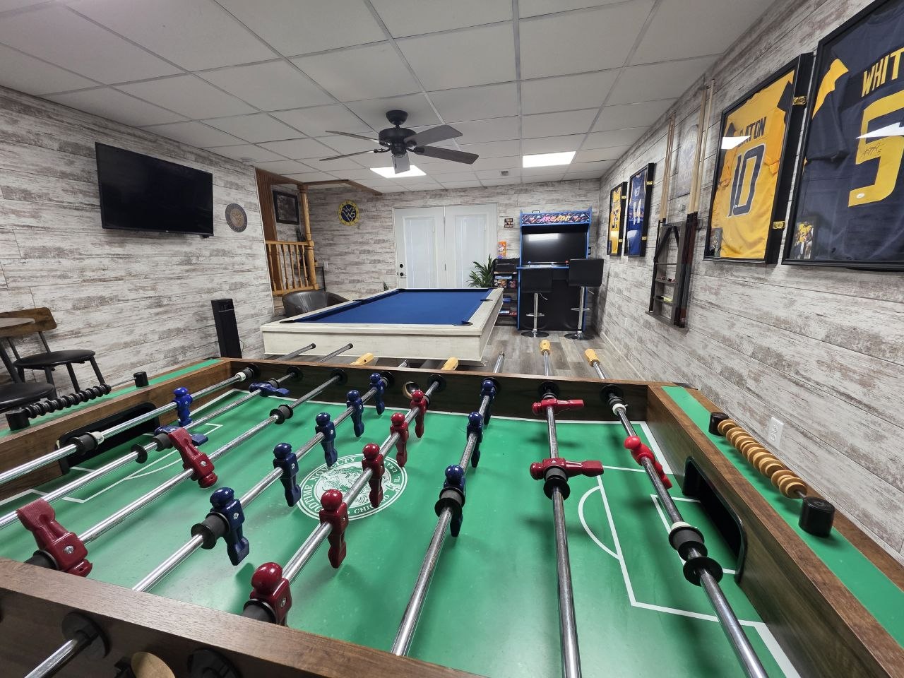Foosball and arcade games in the game room