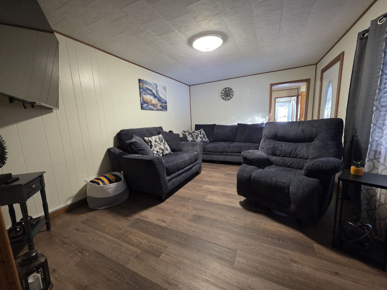 Spacious living area with WVU decor in Morgantown Airbnb