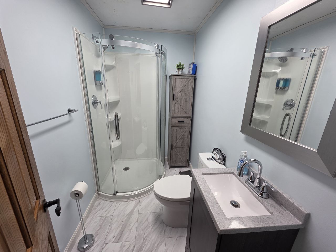 Second bathroom with glass shower in vacation rental near WVU